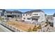 Large backyard featuring a white fence, patio area, and landscaped grounds at 5381 Hickory Oaks Trl, Castle Rock, CO 80104