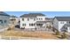 Scenic backyard boasts lush greenery, a charming patio, and serene views of the surrounding neighborhood at 5381 Hickory Oaks Trl, Castle Rock, CO 80104