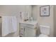Bright bathroom featuring white cabinets, white countertops, and a framed mirror at 5381 Hickory Oaks Trl, Castle Rock, CO 80104