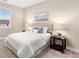 Bright bedroom featuring neutral decor, an upholstered headboard, and carpeted flooring at 5381 Hickory Oaks Trl, Castle Rock, CO 80104