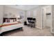 This bedroom has modern neutral tones, carpet, closet, and a black desk with monitors and is brightly lit with natural light at 5381 Hickory Oaks Trl, Castle Rock, CO 80104