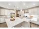 Gourmet kitchen with quartz countertops, stainless steel appliances, and ample cabinet space at 5381 Hickory Oaks Trl, Castle Rock, CO 80104