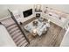 Aerial view of the living room showcasing the open floor plan and fireplace at 5381 Hickory Oaks Trl, Castle Rock, CO 80104