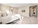 Bright main bedroom showcases neutral decor, carpet, and walk-in closet at 5381 Hickory Oaks Trl, Castle Rock, CO 80104