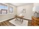 Well-lit home office with a modern desk, stylish decor, and large windows for abundant natural light at 5381 Hickory Oaks Trl, Castle Rock, CO 80104