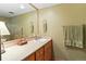 Traditional bathroom features a cream vanity with a basket and neutral toned walls at 207 Kelly E Rd, Boulder, CO 80302