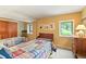 Bedroom featuring two twin beds and a bench in a cozy setting at 207 Kelly E Rd, Boulder, CO 80302