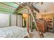 Bedroom boasting green walls, wood accents, and a unique lofted area above the bed at 207 Kelly E Rd, Boulder, CO 80302