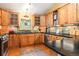 The kitchen has wooden cabinetry, stainless steel appliances, stylish backsplash and countertop at 207 Kelly E Rd, Boulder, CO 80302