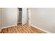 Bright bedroom featuring hardwood floors and an open doorway at 1941 Wabash St, Denver, CO 80220