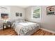 Cozy bedroom with natural light, hardwood floors and a comfortable bed at 1941 Wabash St, Denver, CO 80220