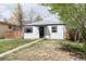 Charming home with a well-maintained lawn and inviting walkway at 1941 Wabash St, Denver, CO 80220