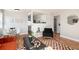 Open-concept living area with dining space, modern decor, and a cozy atmosphere at 1941 Wabash St, Denver, CO 80220