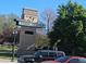 View of the E 29th Avenue Town Center entrance, in a landscaped setting at 1941 Wabash St, Denver, CO 80220