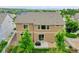 Back exterior of home featuring a patio, a well manicured lawn, and white fencing at 20145 E Fair Ln, Centennial, CO 80016
