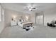 Large bedroom features a ceiling fan, neutral decor and adjacent sitting area at 20145 E Fair Ln, Centennial, CO 80016