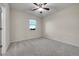 Empty bedroom with carpeted floor, ceiling fan and a sunny window at 20145 E Fair Ln, Centennial, CO 80016