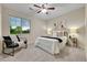 Bright bedroom with a ceiling fan and large windows offer ample light and neighborhood views at 20145 E Fair Ln, Centennial, CO 80016