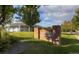 Community clubhouse with brick sign, well-maintained lawn, and mature landscaping at 20145 E Fair Ln, Centennial, CO 80016