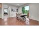 Dining room features modern light fixture, large window, and view to front entry at 20145 E Fair Ln, Centennial, CO 80016
