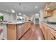Open kitchen with stainless steel appliances, granite counters and seamless view to living area at 20145 E Fair Ln, Centennial, CO 80016