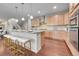 Modern kitchen with granite counters, stainless steel appliances and island seating at 20145 E Fair Ln, Centennial, CO 80016