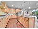 Spacious kitchen with an island, granite countertops, stainless steel appliances, and hardwood floors at 20145 E Fair Ln, Centennial, CO 80016