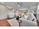 Comfortable living room with a view to an open-concept kitchen, hardwood floors, and modern decor at 20145 E Fair Ln, Centennial, CO 80016