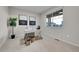 A carpeted home office provides ample natural light from a window and a neutral color palette at 20145 E Fair Ln, Centennial, CO 80016
