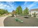 Community playground featuring modern equipment with safety surface at 20145 E Fair Ln, Centennial, CO 80016