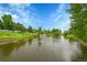 Scenic pond in a community with mature trees and walking paths at 20145 E Fair Ln, Centennial, CO 80016