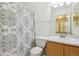 Clean bathroom with shower/tub combo and wood vanity at 1255 Finch Ave, Brighton, CO 80601