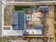 Aerial view of a property showing the house, a driveway, backyard with artificial grass, and other structures on the lot at 2415 E Maplewood Ave, Centennial, CO 80121