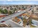 Aerial view of a home in a suburban neighborhood near a street at 2415 E Maplewood Ave, Centennial, CO 80121