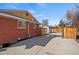 Side yard with concrete pad and access to storage shed at 2415 E Maplewood Ave, Centennial, CO 80121