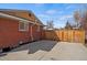 Side yard with concrete pad and access to storage shed at 2415 E Maplewood Ave, Centennial, CO 80121