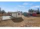 Backyard view of multiple storage sheds and back of the home at 2415 E Maplewood Ave, Centennial, CO 80121