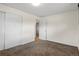 Bright bedroom featuring carpet flooring and a closet, offering a cozy and functional space at 2415 E Maplewood Ave, Centennial, CO 80121