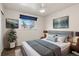 Bright bedroom with picture window, modern decor, and comfortable furnishings at 2415 E Maplewood Ave, Centennial, CO 80121