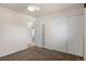 Carpeted bedroom with closet, entry and white walls at 2415 E Maplewood Ave, Centennial, CO 80121