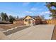 Beautifully renovated single Gathering home with spacious driveway and charming brick and wood facade at 2415 E Maplewood Ave, Centennial, CO 80121