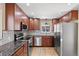 Well lit kitchen with stainless appliances and granite countertops at 2415 E Maplewood Ave, Centennial, CO 80121