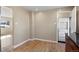 An eat-in-kitchen nook with hardwood floors, neutral paint and access to the kitchen at 2415 E Maplewood Ave, Centennial, CO 80121