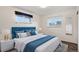 Serene bedroom with large bed, bedside tables, and large windows at 2415 E Maplewood Ave, Centennial, CO 80121