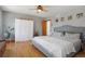 Bright bedroom with a ceiling fan, a large closet, and a comfortable queen-sized bed at 36023 Winchester Rd, Elizabeth, CO 80107