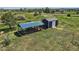 Backyard shed and chicken coop on a grassy lot in a residential area at 36023 Winchester Rd, Elizabeth, CO 80107