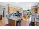 Bright kitchen with stone countertops, mosaic backsplash, stainless steel appliances, and adjacent dining area at 36023 Winchester Rd, Elizabeth, CO 80107