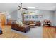 Bright living room featuring skylight, hardwood floors, and sectional seating at 36023 Winchester Rd, Elizabeth, CO 80107
