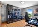 Home office boasting expansive display cabinets, ideal for showcasing collectibles and enhancing the workspace at 36023 Winchester Rd, Elizabeth, CO 80107