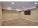 Finished basement area featuring carpet, recessed lighting, and a mounted television at 4784 Raven Run, Broomfield, CO 80023